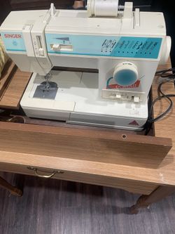Sewing machine and table