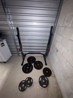 Rack and weights and bar