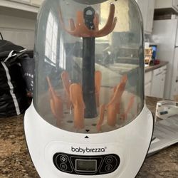Baby Brezza baby sterilizer and dry machine plus bottle warmer