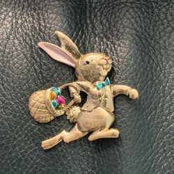 Easter Bunny brooch with  Easter egg basket  1.75”x1.75” Material: rhinestones and alloy 