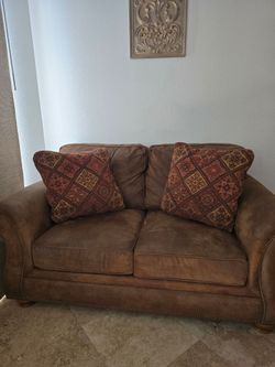 Brown Loveseat with Nailhead Trim