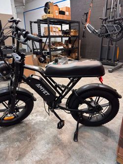 AMYET G60 moped-style electric bike in black with 20" x 4" fat tires.