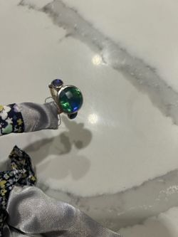 Green and purple crystal ring in silver