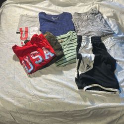 6 Shirts And 1 Pair Of Shorts