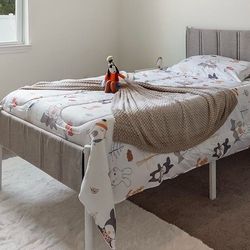 Brand new twin sized white bed frame with upholstered headboard and footboard