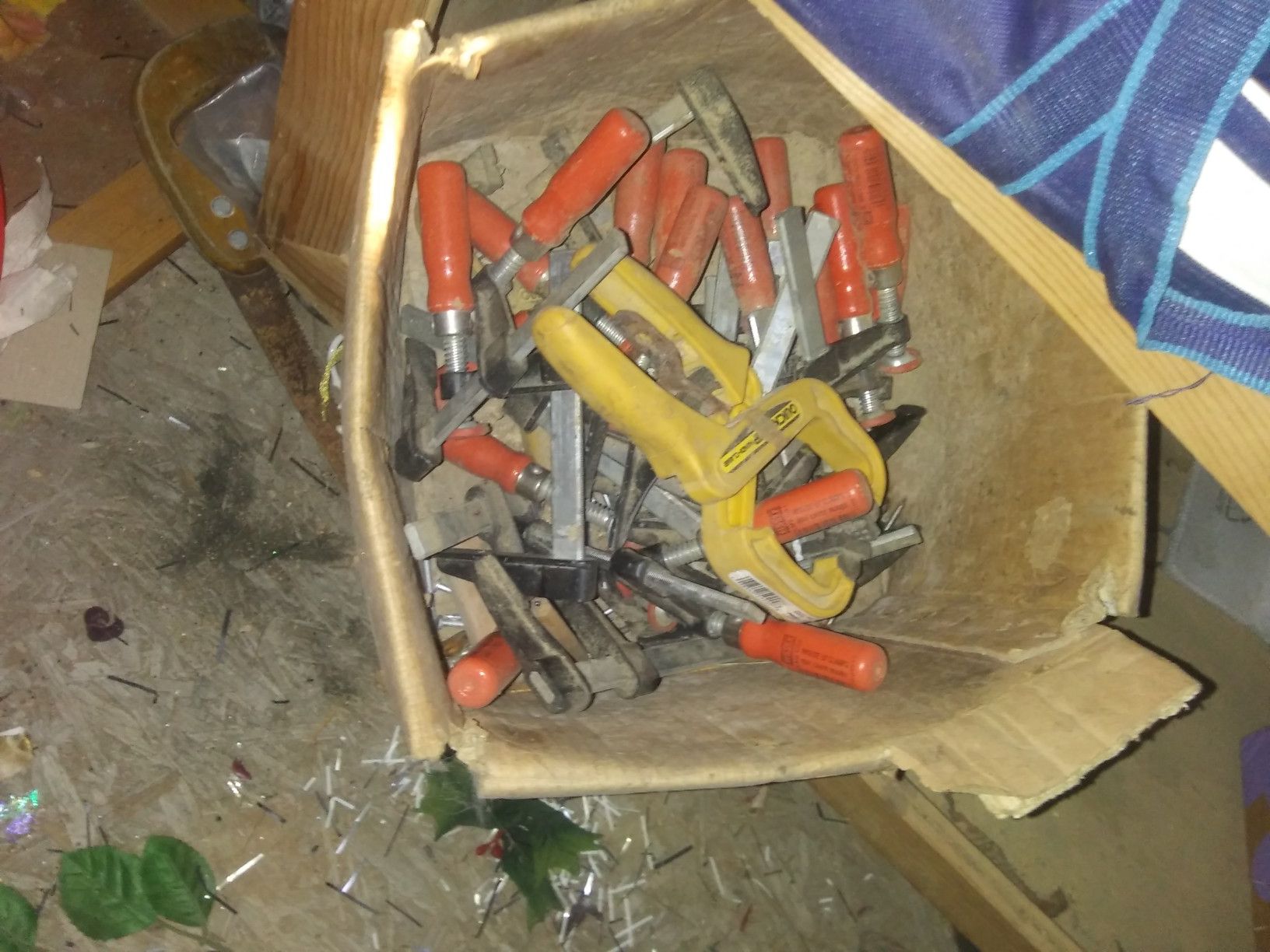 Box full of wood clamps