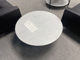 Modern Round Marble-Look Coffee Table with Sculptural Black Base – $195 OBO