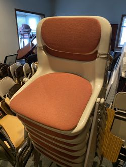 Orange and tan stacking chair $20 each. I have 7.