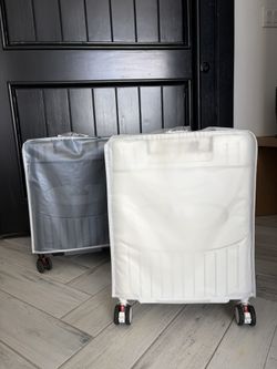 white luggage with seat
