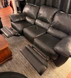 Leather couch with 2 reclining sides!