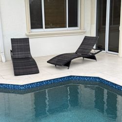 Pair Of  outdoor wicker chaise lounges in brown