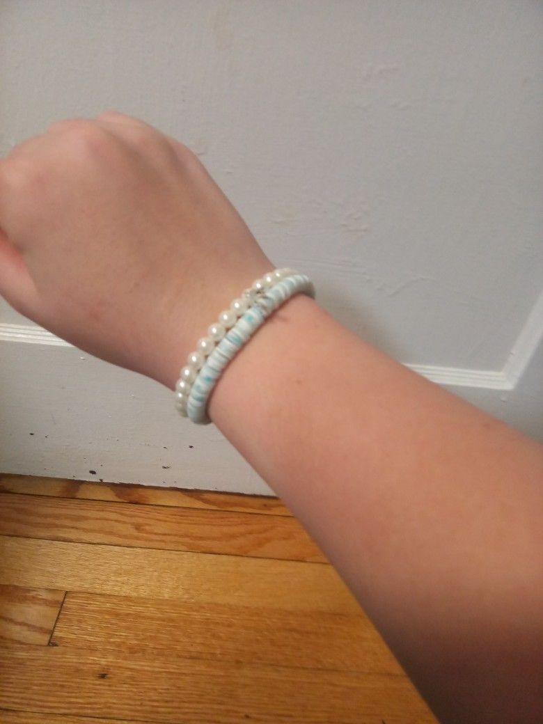 A Set Of Two Beachy Blue Bracelets One Pearl And One Clay Beads