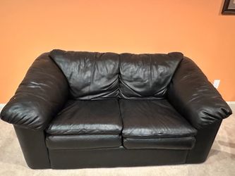 Black faux leather loveseat couch