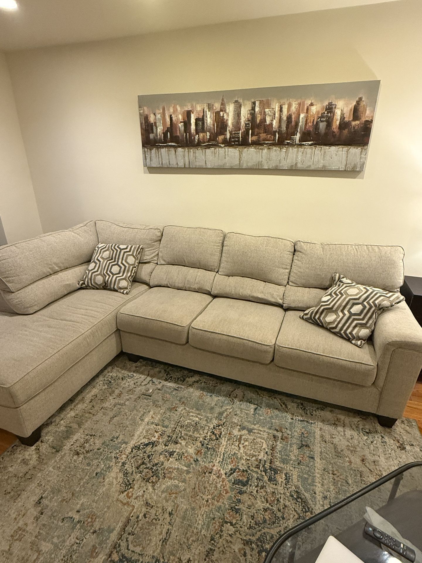 Beige sectional couch for sale with matching cushions included