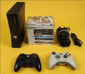 Microsoft Xbox 360 slim with 2 controllers 12 games HDMI cord power supply