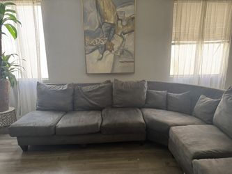 Beautiful gray sectional needs TLC