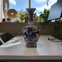 Chinese gilt blue, gold  and white porcelain vase with floral pattern. 