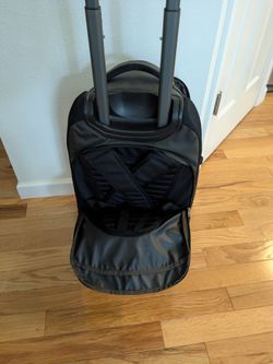 REI convertible travel rolling suitcase/backpack