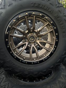 20x10. BRONZE WHEELS AND USED 37x13.50R20. 
