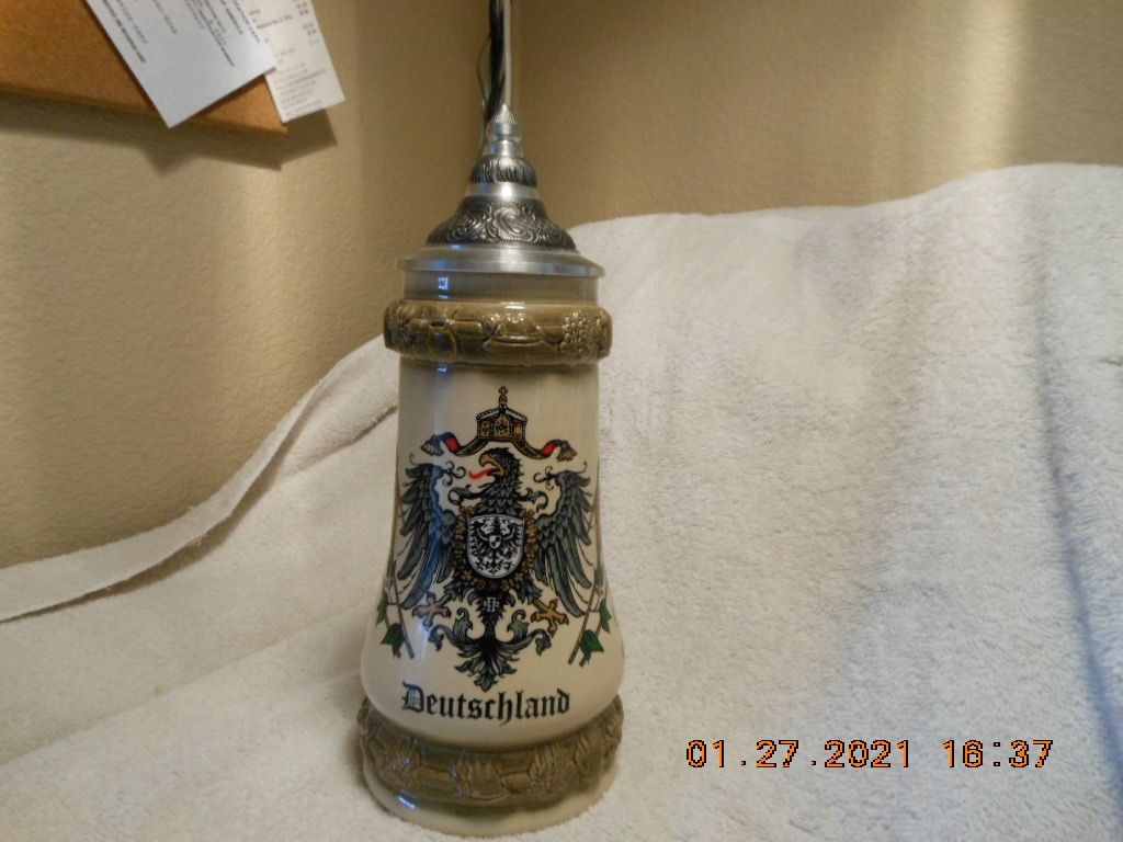 Very RARE Deutschland Lidded Beer Stein w/a figure of an Alpine hiker on the handle.