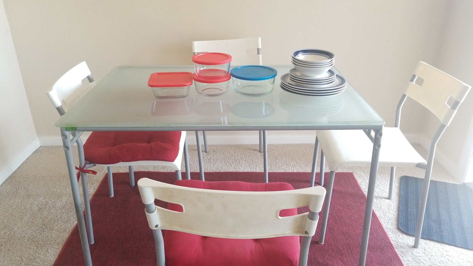 Glass dining table with pyrex containers