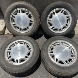 Infiniti j30 15 inch Stock wheels and center caps. 5 on 114.3mm 