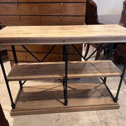 narrow console/sofa table with shelving.