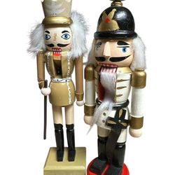 2nutcrackers 10” no original box one of them has missing nose look at photos for wear