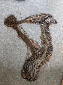 Woven net hammock — earth tones