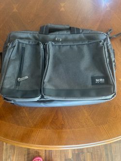Gray  Solo New York Bag is a convertible urban hybrid briefcase backpack that fits laptops up to 15.6 inches