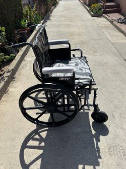 20 inches wide wheelchair in excellent condition with footrest