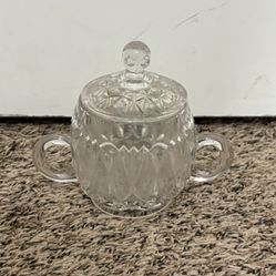 Clear glass sugar bowl with lid
