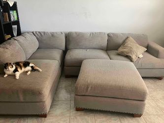 Large Gray Fabric Sectional Sofa + Ottoman (Costco) — sofa, chaise & ottoman