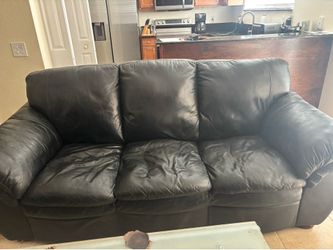 Complete four piece, black leather couch set with footstool