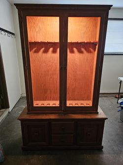 Custom built solid oak hunting cabinet/disply hutch