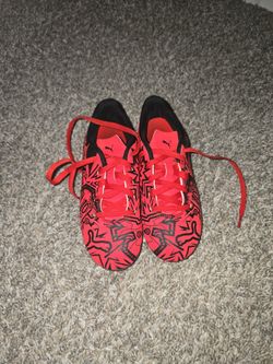  Puma x Christian Pulisic Tacto II FG/AG kids' soccer cleats in the red/black