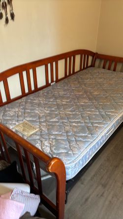 Free twin bed,,wood frame, good mattress.