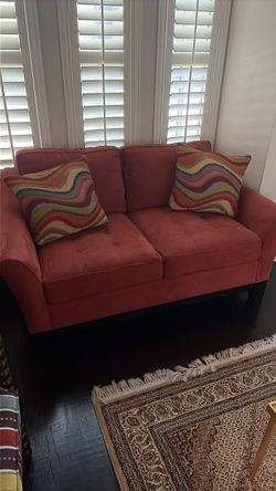 Rusted orange 2 seater couch