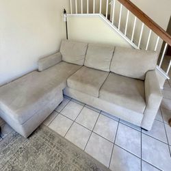 Living Spaces Light Gray Modern Reversible Chaise Sofa