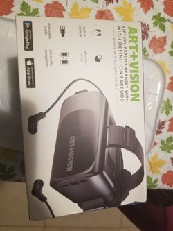 Virtual reality headset with earbuds