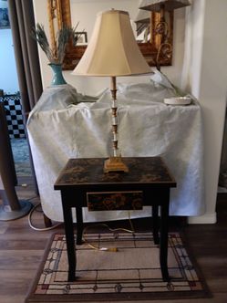 Accent table and lamp balck with gold flowers,lamp muted gold and clear,