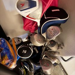 Assorted golf clubs