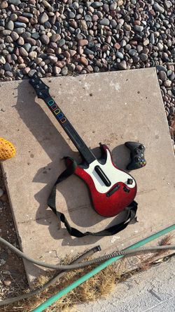 Wireless Xbox 360 controller and guitar hero guitar but has no back for the battery cover