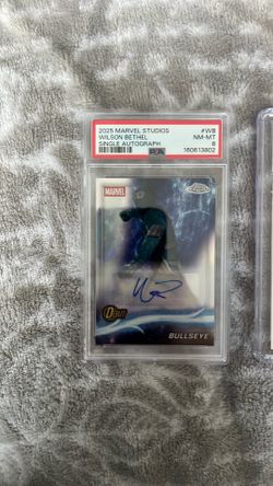 Two marvel trading cards graded