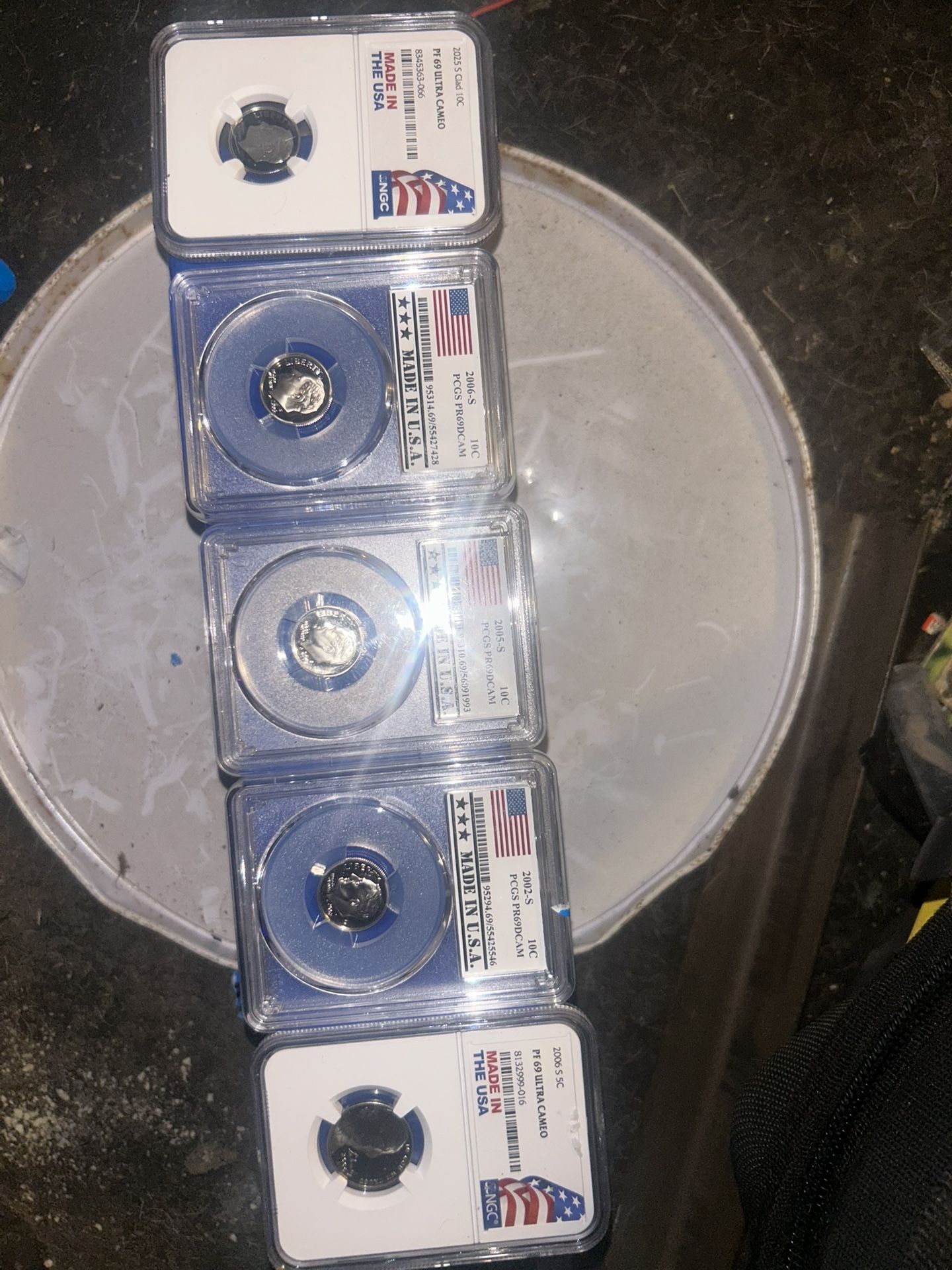Five individual slabbed coins all of them are MS 69 ultra cameo deep cam