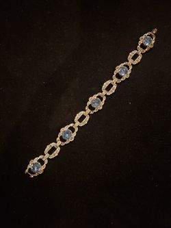 $99. Art Deco E.B. Engel Brothers 1930's Blue Topaz tennis bracelet. 7 inches long. 5/8 inch wide.