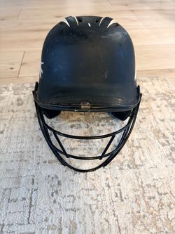 softball Softball batting helmet with an attached face guard
