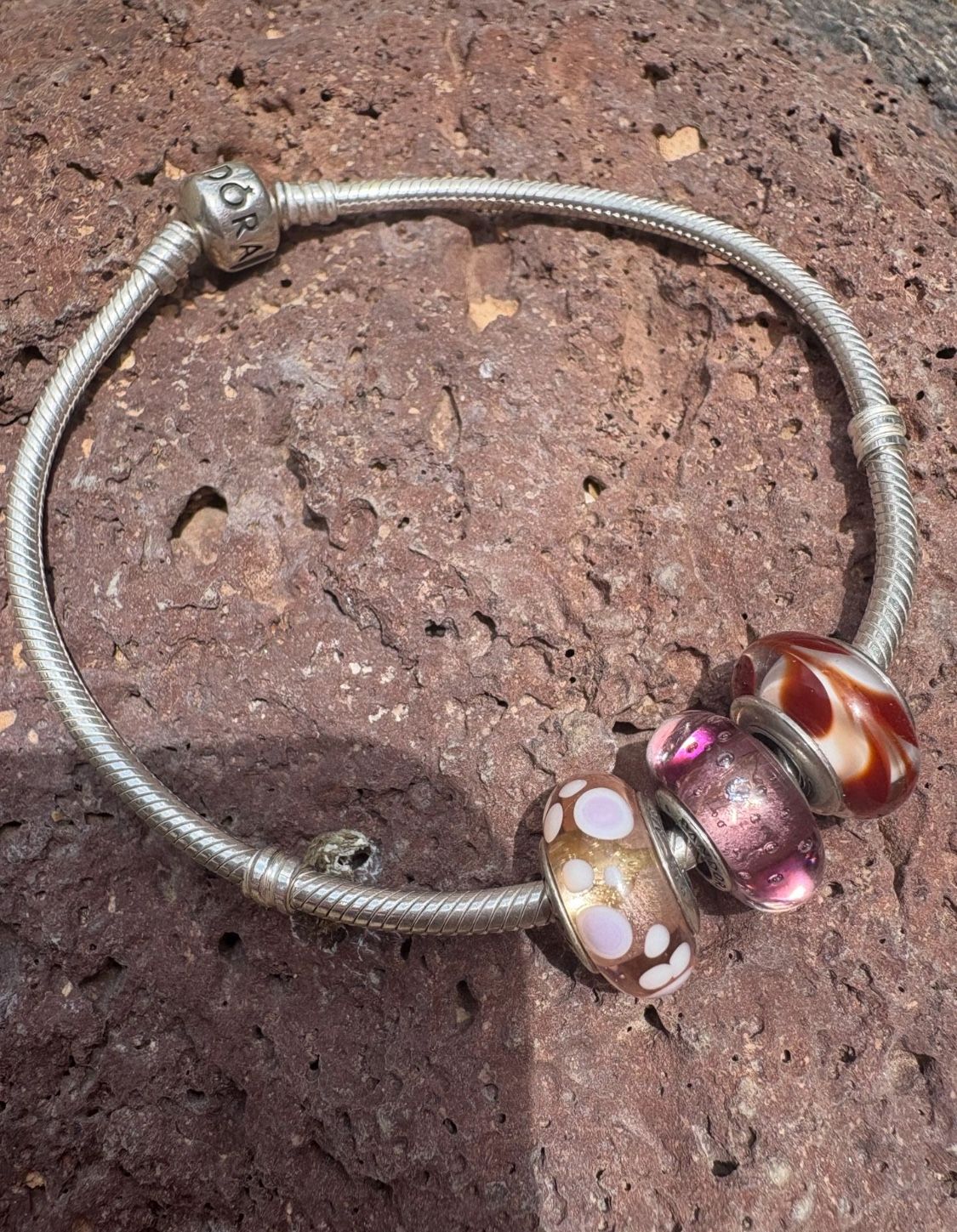 Elegant Pandora Sterling silver 9” bracelet featuring 3 Pandora charms