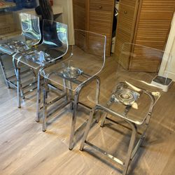 4 x Acrylic swiveling bar stools / chrome
