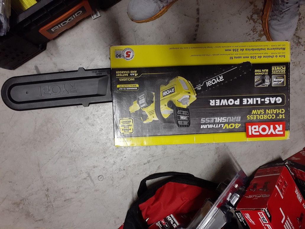 Brand new Ryobi 40v chainsaw kit with big battery charger